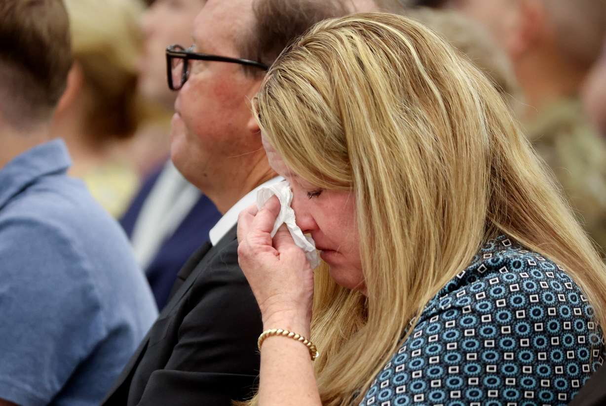 Nancy Maksym wipes tears from her eyes during the memorial service for her grandfather, 1st Lt. George Wilson, at the Hill Aerospace Museum at Hill Air Force Base on Tuesday. The sentiments at the service reflected love and gratitude.