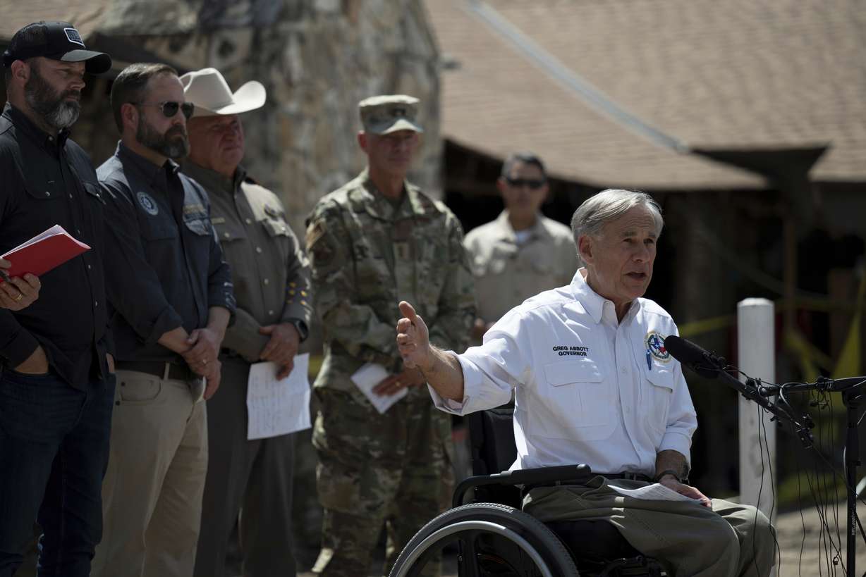Texas Gov. Greg Abbott speaks during a press conference on Tuesday after touring damage from flash flooding in Hunt, Texas. Abbott said the search for victims will not stop until all are found.