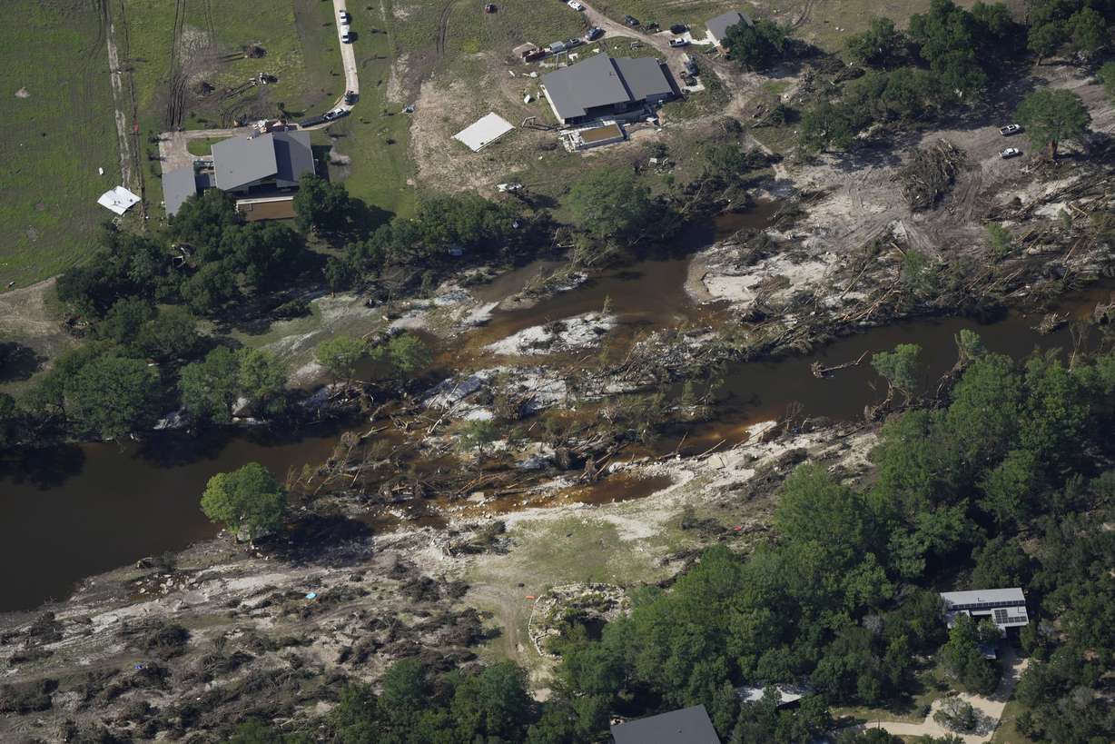 Damage is seen next to the Guadalupe River on Tuesday, after a flash flood swept through the area near Ingram, Texas.