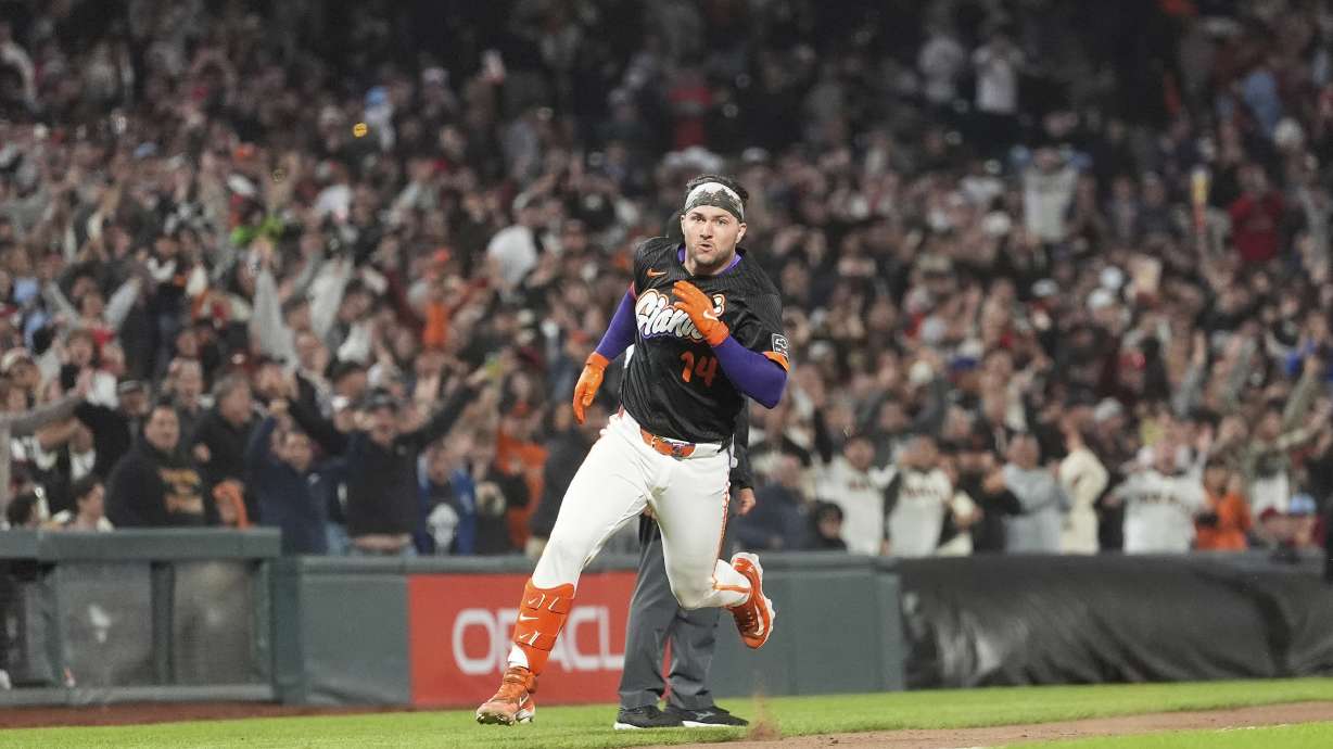 San Francisco Giants' Patrick Bailey runs home to score after hitting a three-run inside the park home run during the ninth inning of a baseball game to defeat the Philadelphia Phillies in San Francisco, Tuesday, July 8, 2025.