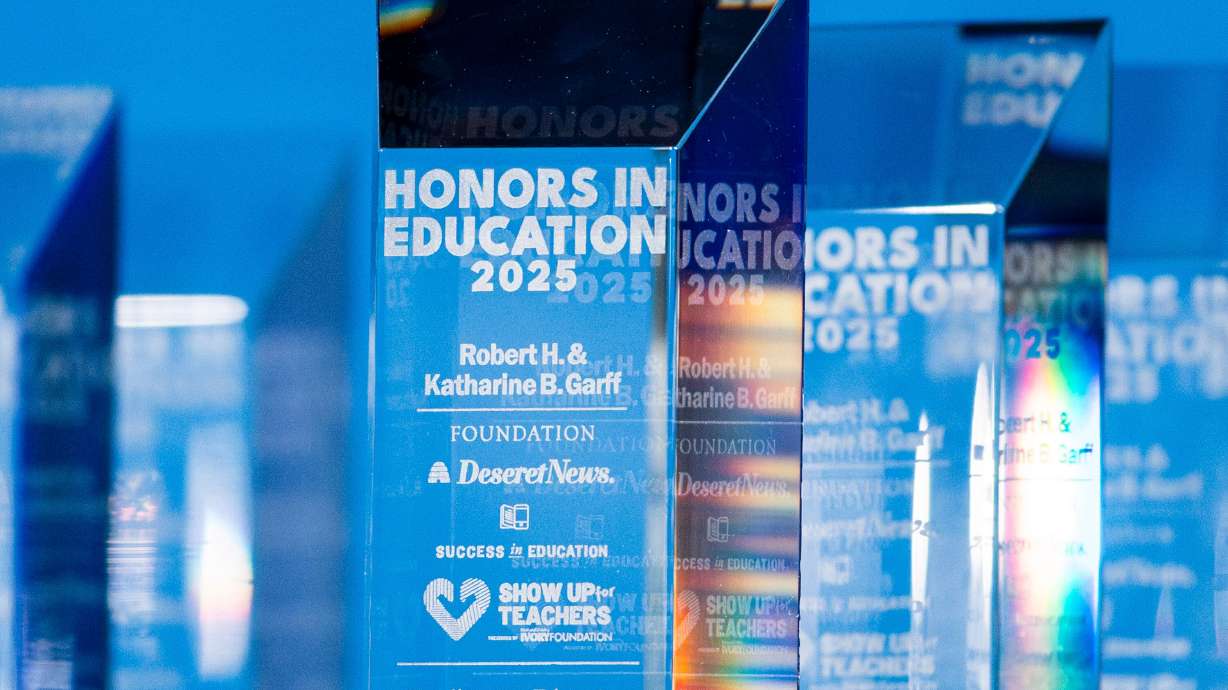 Awards are displayed onstage during the Show Up For Teachers — Honors in Education Awards Gala held at the Grand America Hotel in Salt Lake City on Tuesday.