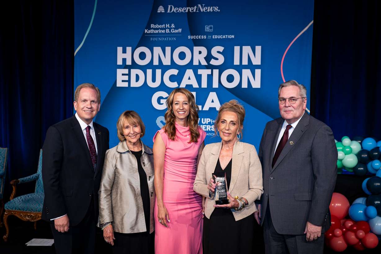 Camie Palmer, second from right, a kindergarten teacher at The Center for Creativity, Innovation, and Discovery, holds the distinguished educator lifetime achievement award as she poses with, from left, Deseret News publisher Burke Olsen; Kathi Garff, board chair of the Ken Garff Automotive Group; Utah first lady Abby Cox; and Deseret News executive editor Doug Wilks during the Show Up For Teachers – Honors in Education Awards Gala held at the Grand America Hotel in Salt Lake City on Tuesday.