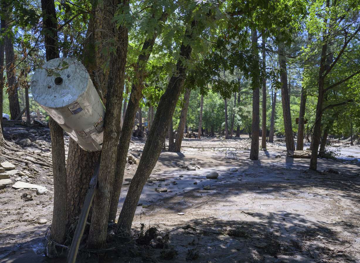 A water heater got wedged between trees near the downtown area in the town of Ruidoso, N.M., Wednesday, during major flash flooding the previous day.