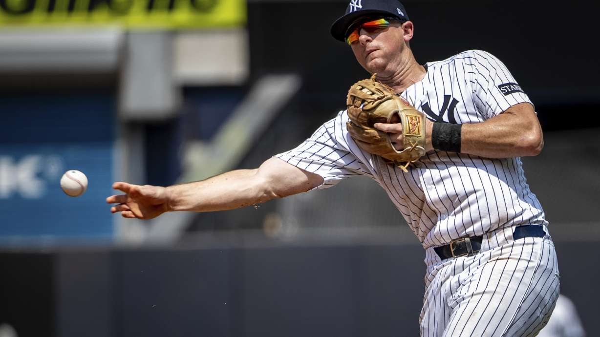 New York Yankees second base DJ LeMahieu (26) grounds out Athletics' Max Muncy (10) during the sixth inning of a baseball game, Saturday, June 28, 2025, in New York.