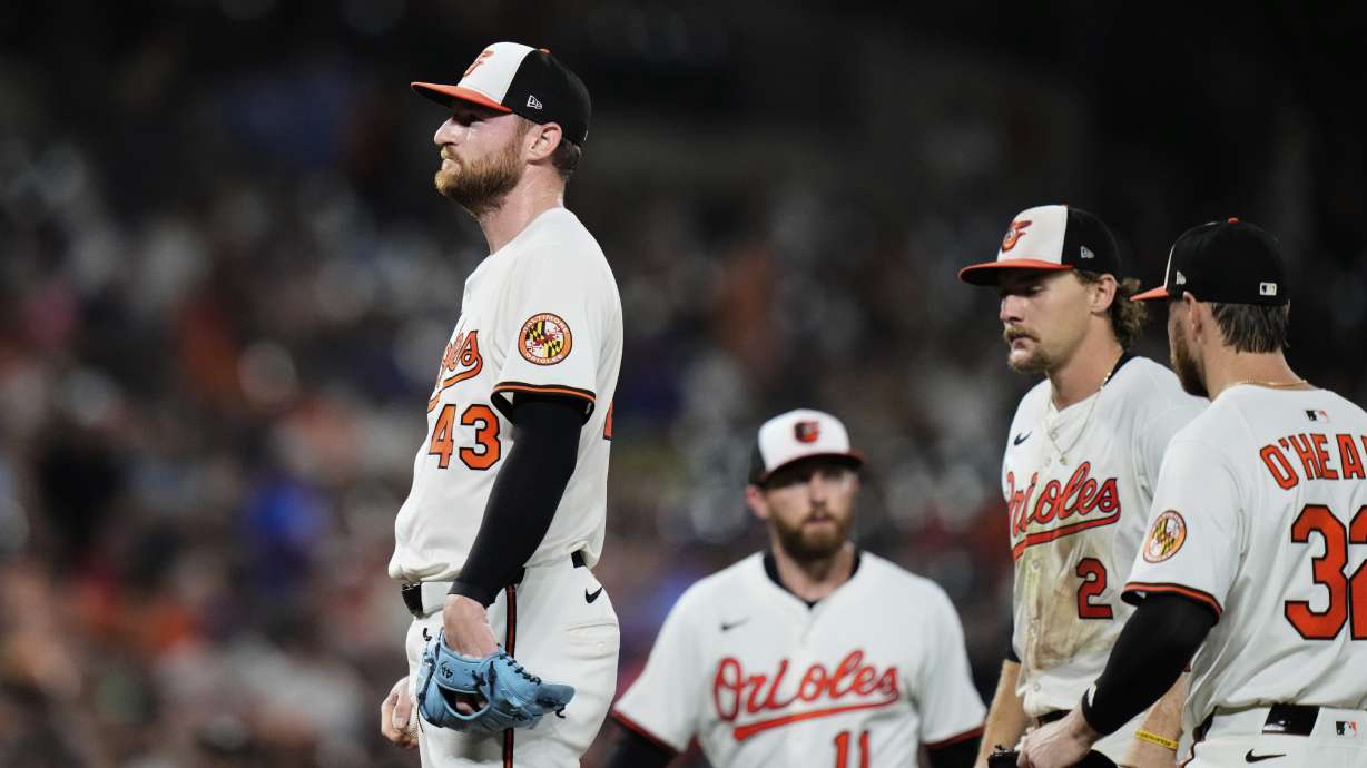 Baltimore Orioles relief pitcher Bryan Baker (43) leaves the mound in a pitching substitution after giving up four runs during the eighth inning of a baseball game against the New York Mets, Tuesday, July 8, 2025, in Baltimore.