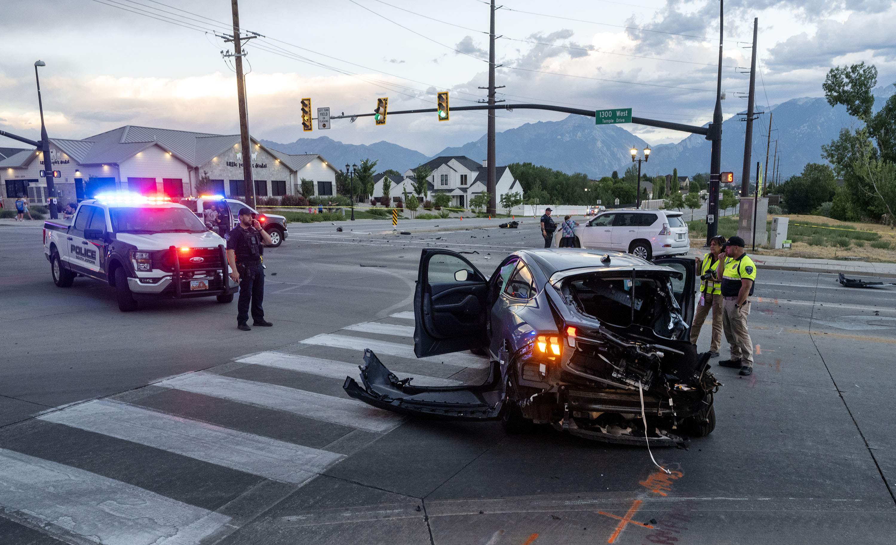 South Jordan and Herriman officers investigate after a fatal accident at 1300 West and 11400 South in South Jordan on Wednesday.