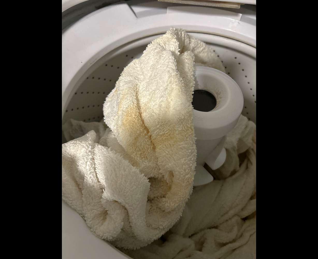 Natalie Holt and some other Ogden residents report brownish tap water, an issue that has spurred a handful of complaints and reports dating to February 2025. The photo shows a white towel stained after it was washed with discolored tap water at Holt's home.