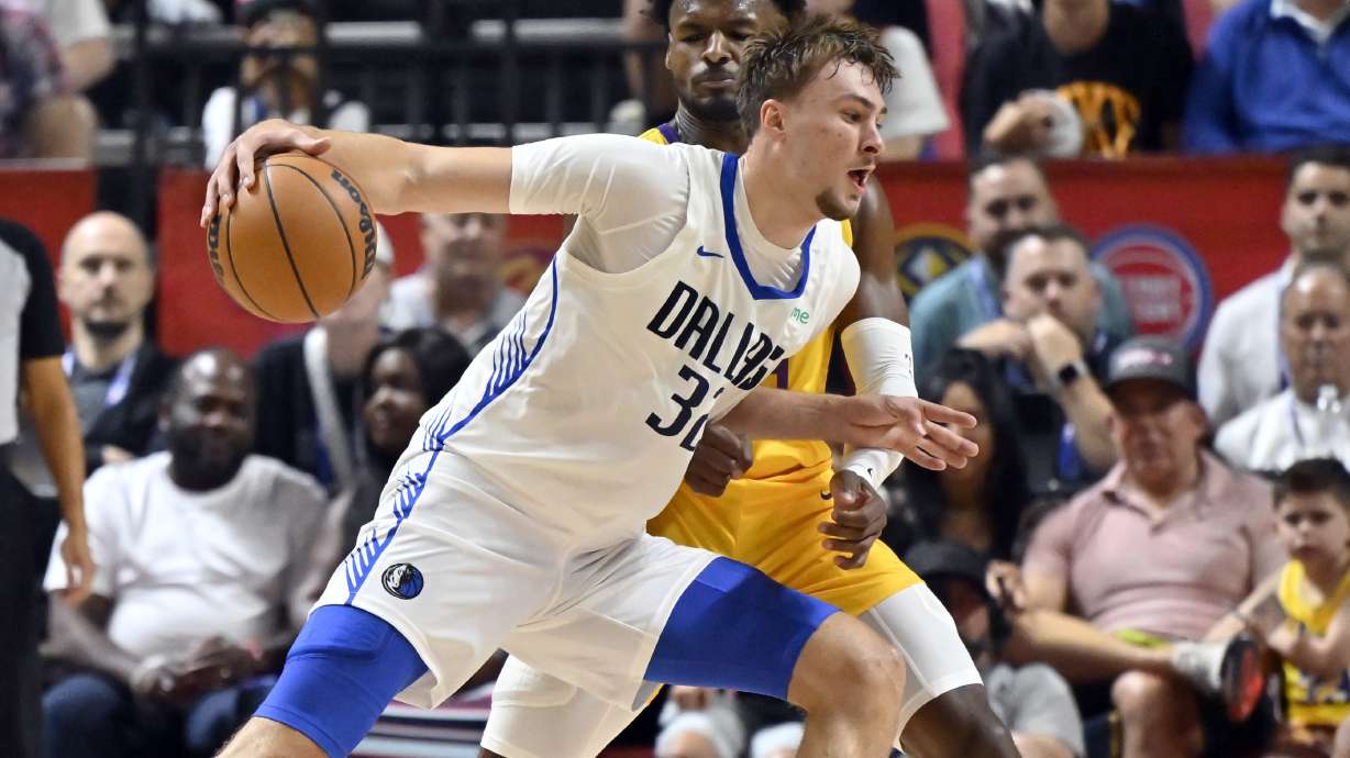 Dallas Mavericks forward Cooper Flagg (32) drives the ball against Los Angeles Lakers guard Bronny James (9) during the first half of an NBA summer league basketball game Thursday, July 10, 2025, in Las Vegas.