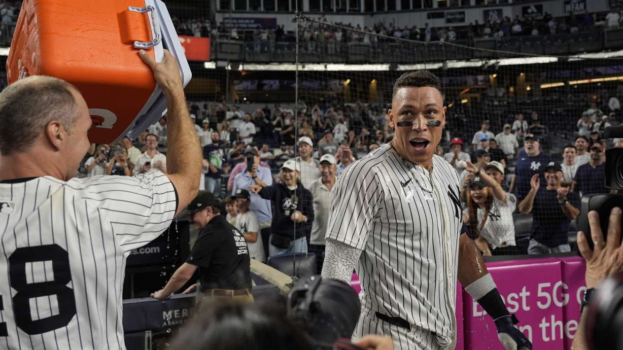 New York Yankees players throw Gatorade on designated hitter Aaron Judge after winning a baseball game against the Seattle Mariners, Thursday, July 10, 2025, in New York.