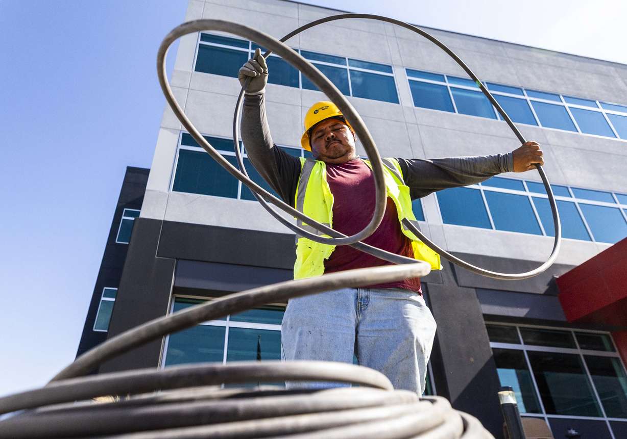 Eufemio Aguayo, an H-2B visa worker from Mexico, works on installing an irrigation system for Stratton Landscape Group in Lindon on July 1. Utah immigrants make up 20% of the construction workforce.