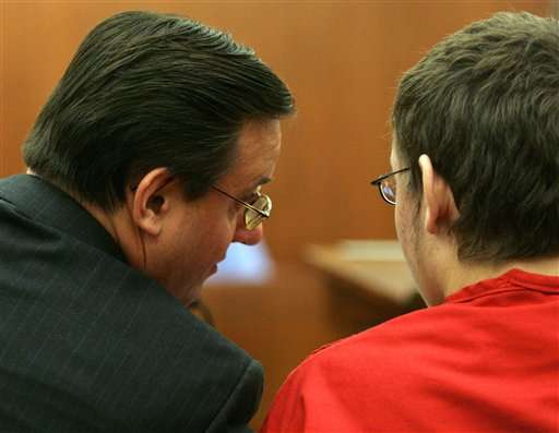 Defense Attorney Todd Utzinger talks with Jeremy Jacob Hauck, 18, during a preliminary hearing at the 2nd District Court in Farmington, Utah, Monday, Sept. 25, 2006. Hauck is being charged with first-degree murder in connection with the death of his mother, Laura. (AP Photo/Robert Johnson, Pool)
