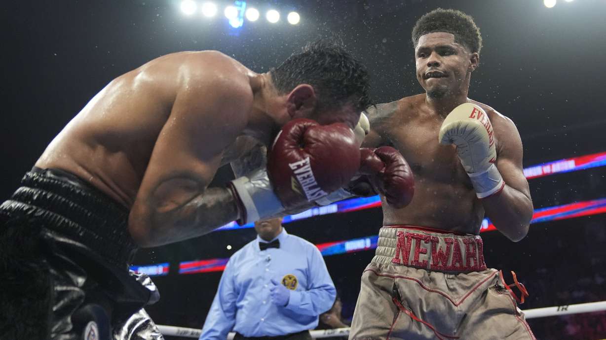 FILE - Shakur Stevenson, right, punches Germany's Artem Harutyunyan during the ninth round of a WBC world lightweight championship boxing match Sunday, July 7, 2024, in Newark, N.J. Stevenson won the fight.