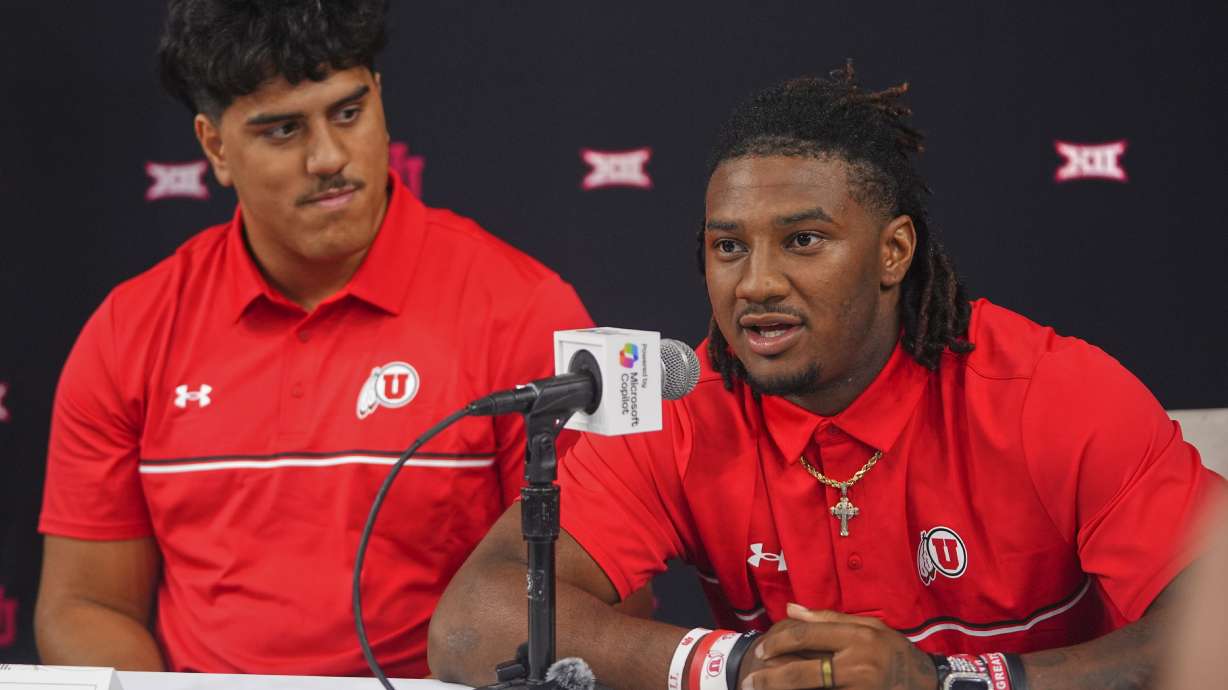Utah quarterback Devon Dampier, right, speaks as teammate offensive lineman Spencer Fano looks on during the Big 12 NCAA college football media days in Frisco, Texas, Wednesday, July 9, 2025.
