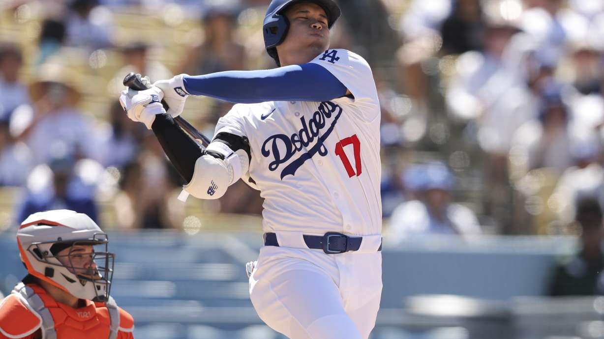 Los Angeles Dodgers designated hitter Shohei Ohtani swings during the eighth inning of a baseball game against the Houston Astros, Sunday, July 6, 2025, in Los Angeles.