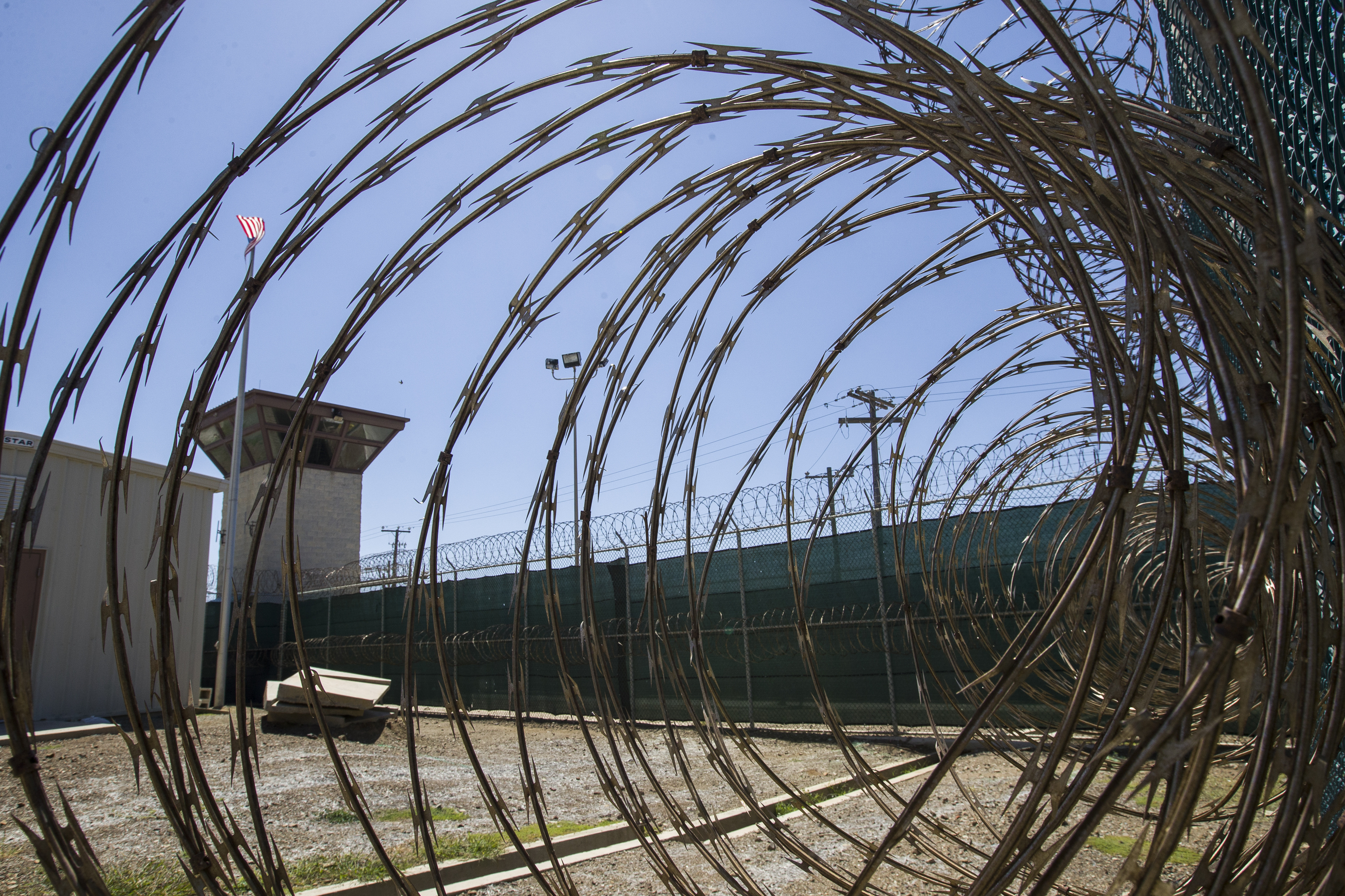 The control tower is seen through the razor wire inside the Camp VI detention facility in Guantanamo Bay Naval Base, Cuba, April 17, 2019. Abu Zubaydah had his detention reviewed on Thursday.