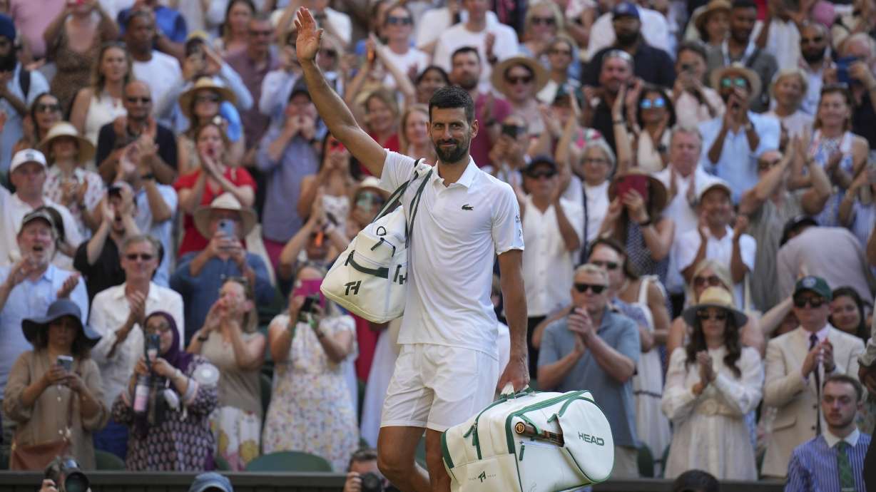 Serbia's Novak Djokovic leaves the court after losing to Italy's Jannik Sinner in a men's singles semifinal at the Wimbledon Tennis Championships in London, Friday, July 11, 2025.