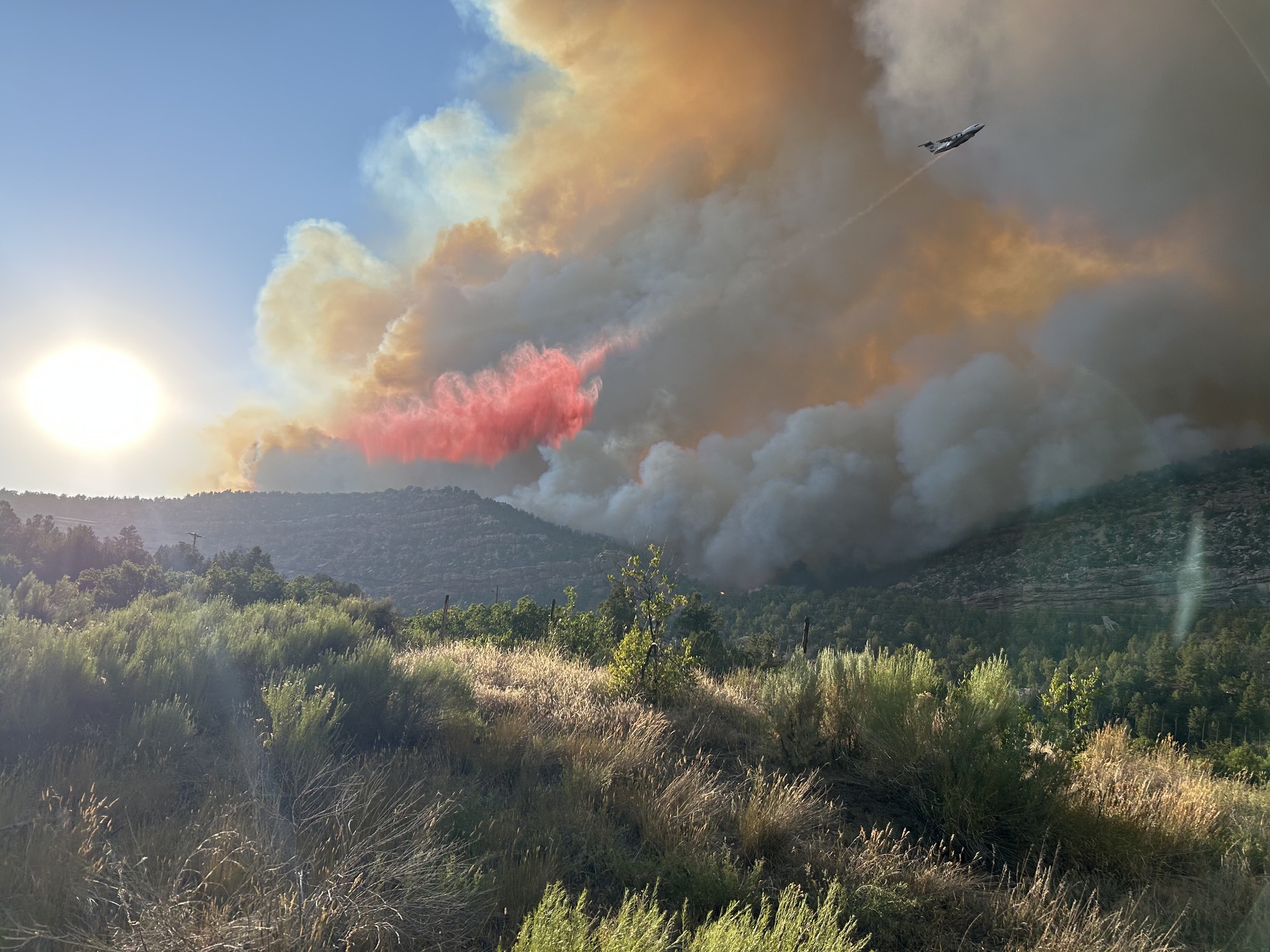Crews battle the Deer Creek Fire burning near La Sal, San Juan County, on Friday. State officials said nine structures have burned since the fire began on Thursday.