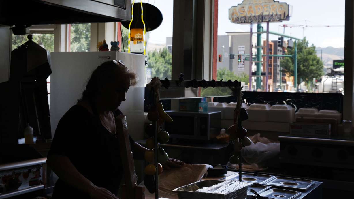 Imelda Morales cooks lunch at El Asadero in Salt Lake City on Thursday. El Asadero, which opened in 2009, will close after its last day of business on July 31.