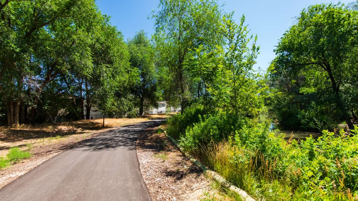 A new section of the Jordan River Parkway trail near 500 North is pictured on Friday. The three-block section of the trail in the area reopened for the first time since it was closed on March 31.