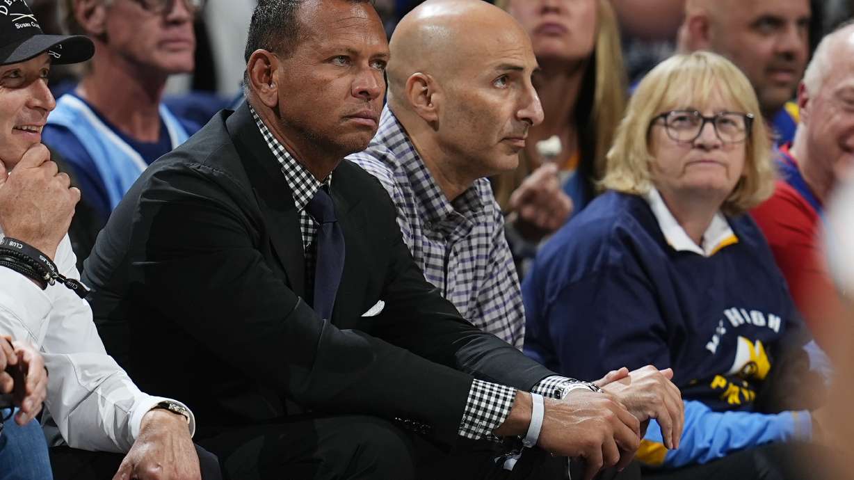 FILE - Minnesota Timberwolves minority owners Alex Rodriguez, front, and Marc Lore look on in the second half of Game 1 of an NBA basketball second-round playoff series against the Denver Nuggets, May 4, 2024, in Denver.