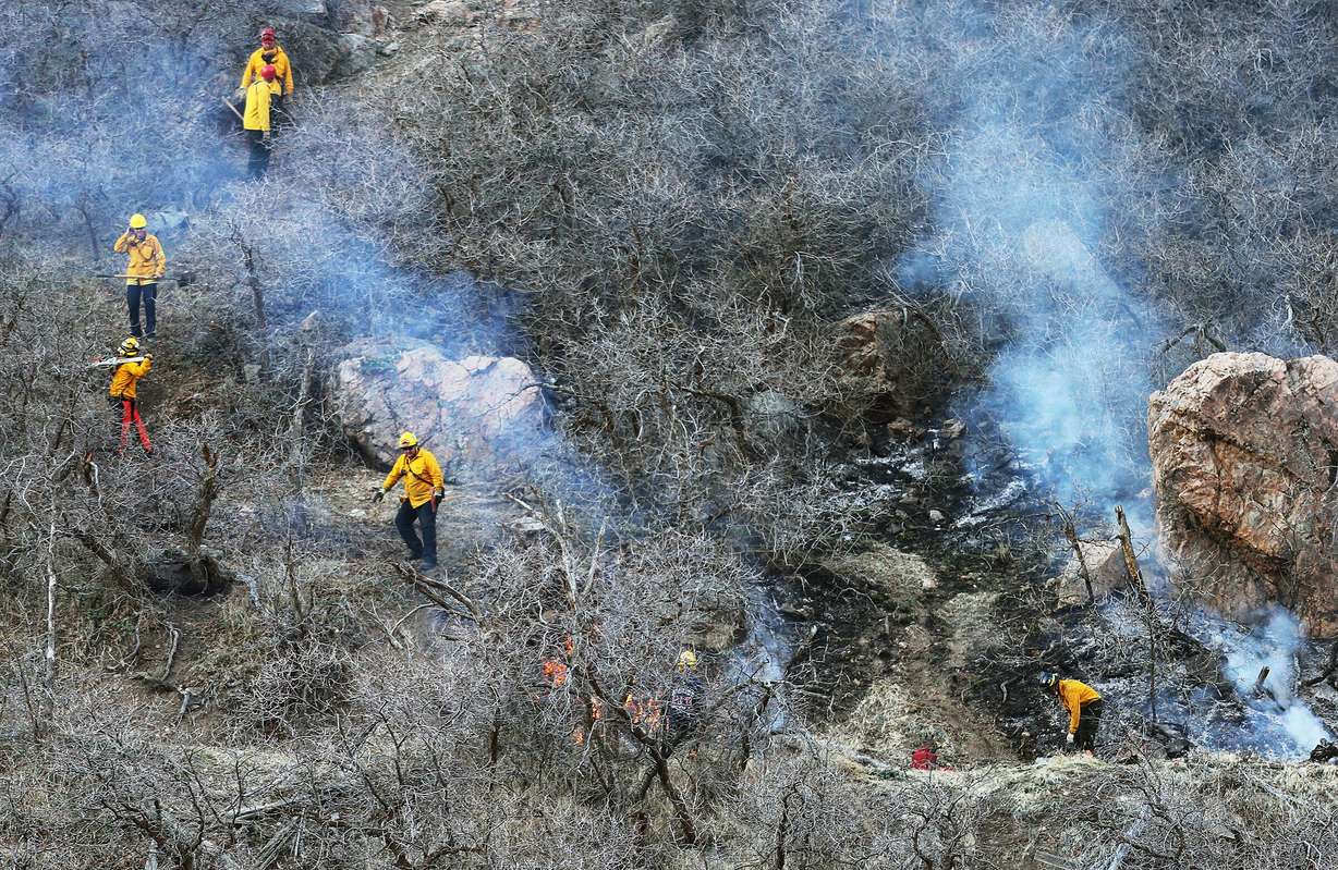 Firefighters respond to a small brush fire at the mouth of Big Cottonwood Canyon on Feb. 8, 2015.