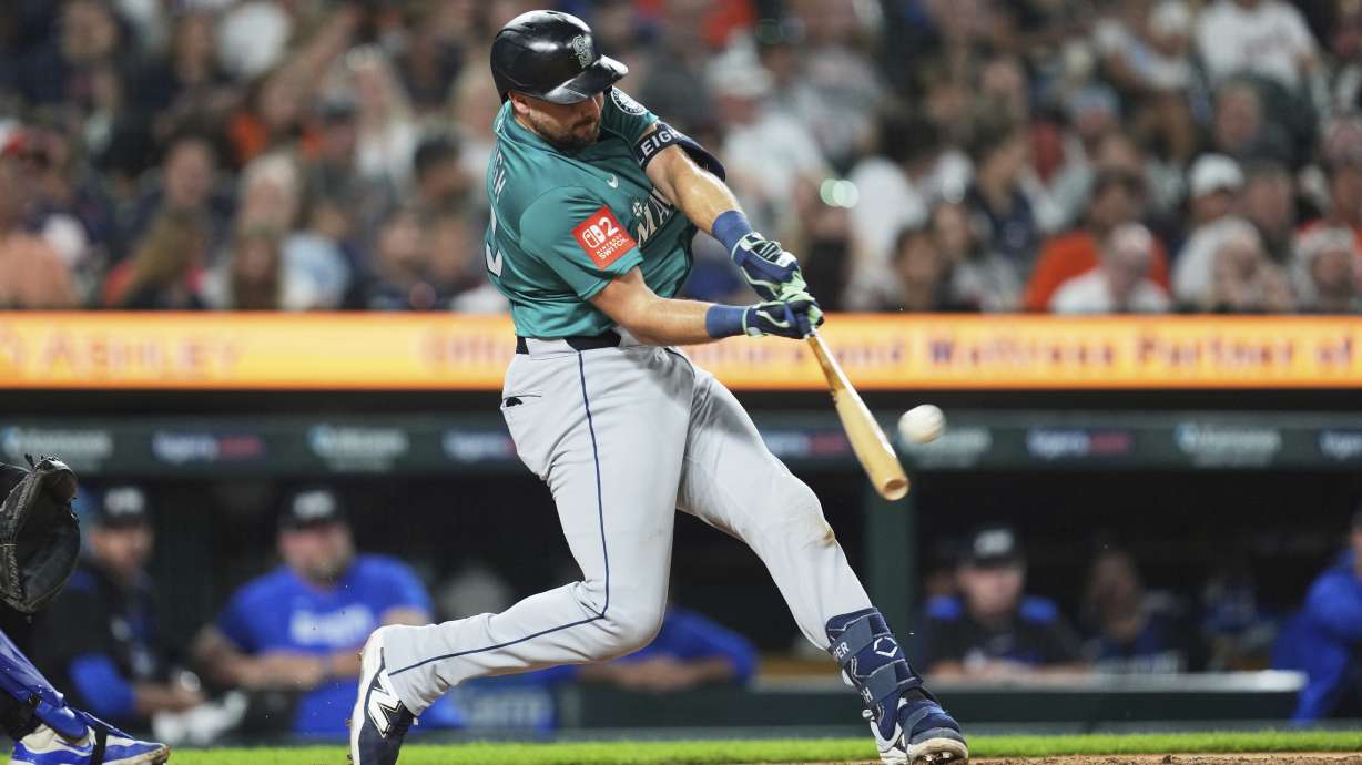 Seattle Mariners' Cal Raleigh hits a grand slam against the Detroit Tigers in the ninth inning during a baseball game, Friday, July 11, 2025, in Detroit.