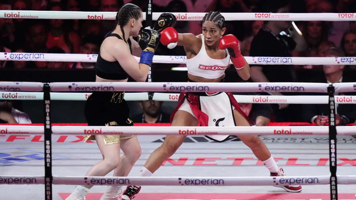 Puerto Rico's Amanda Serrano, right, punches Ireland's Katie Taylor during the second round of a super lightweight championship boxing match Friday, July 11, 2025, in New York.