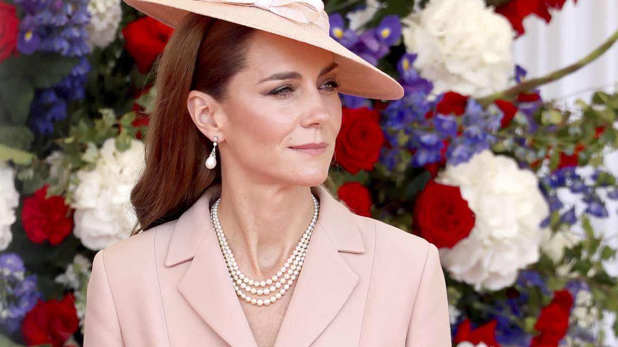 Britain's Kate, Princess of Wales awaits the arrival of France's President Emmanuel Macron and his wife Brigitte Macron in Windsor, England, Tuesday July 8, 2025, on the first day of a three-day state visit to Britain.