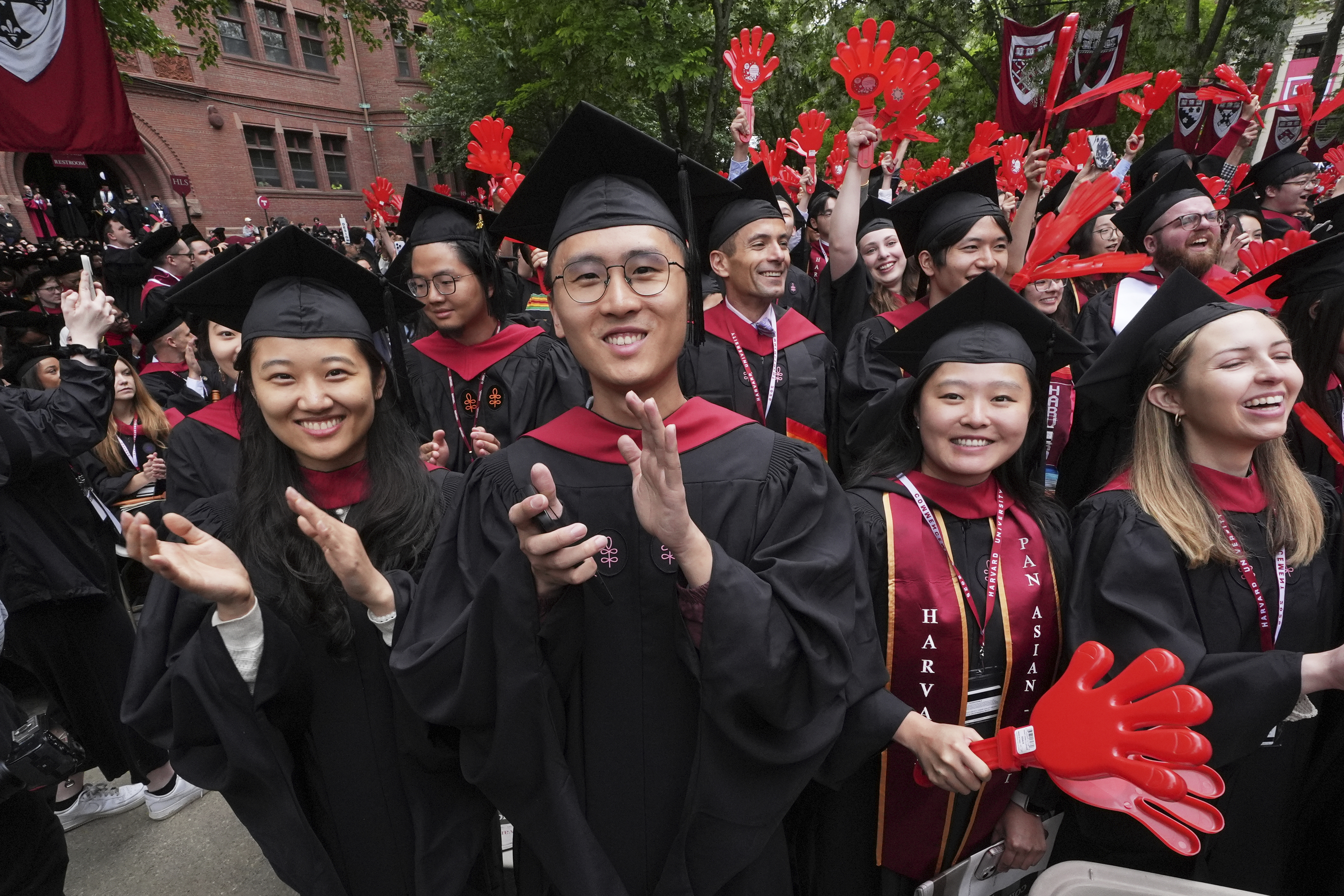 Graduates applaud during commencement ceremonies at Harvard University, May 29, in Cambridge, Mass. News that Harvard is considering starting a conservative think tank is being met with skepticism and derision by conservatives who see the idea as a public relations ploy.