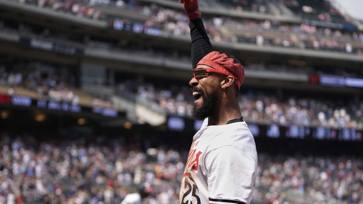 Minnesota Twins' Byron Buxton (25) acknowledges the crowd during a curtain call after hitting a solo home run for the cycle during the seventh inning of a baseball game against the Pittsburgh Pirates, Saturday, July 12, 2025, in Minneapolis.