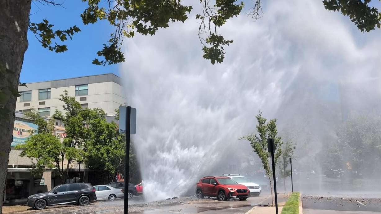 A "geyser" on Center Street from a sinkhole and broken water line on Saturday. Provo is checking pipes in the downtown area more closely for structural integrity after the geyser damaged the road, cars and businesses.