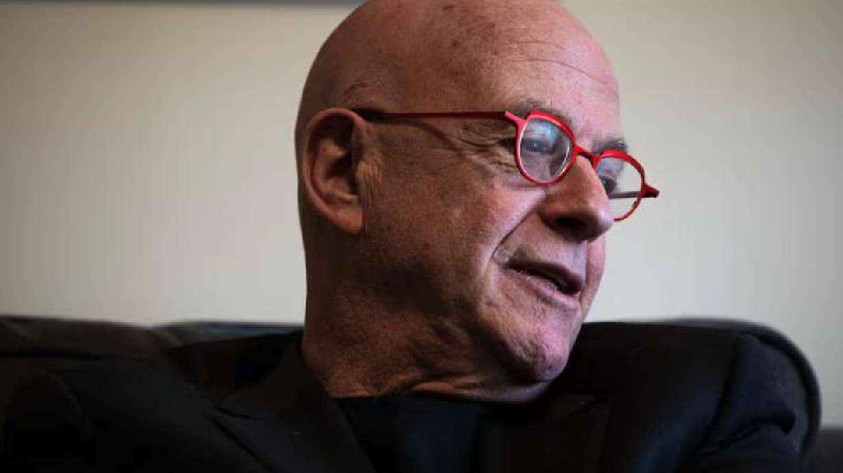 Amos Guiora talks about books that were taken by Nazis from his Jewish grandfather during World War II at his home in Salt Lake City on Feb. 24.