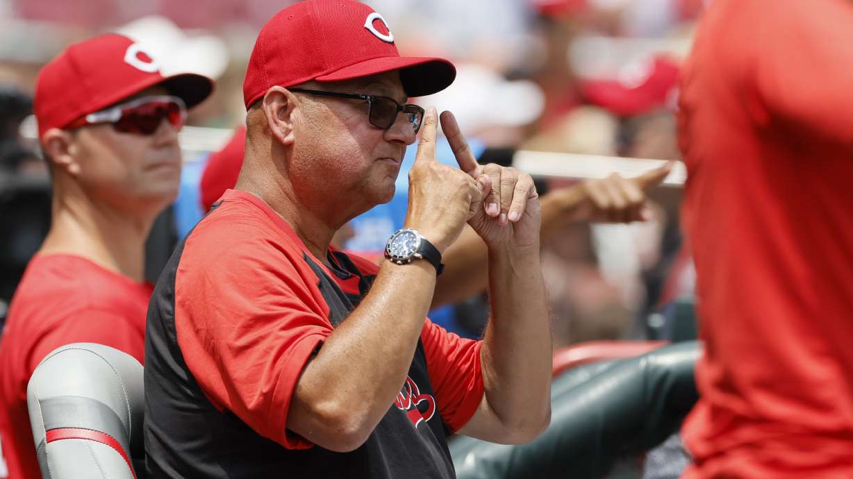 Cincinnati Reds manager Terry Francona signals to his team against the Colorado Rockies during the third inning of a baseball game, Sunday, July 13, 2025, in Cincinnati.