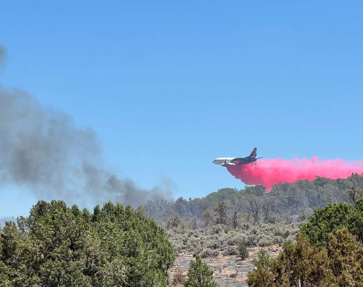 This photo provided by the Bureau of Land Management shows aerial resources working to suppress White Sage wildfire burning north of Grand Canyon National Park in Ariz., on Thursday.