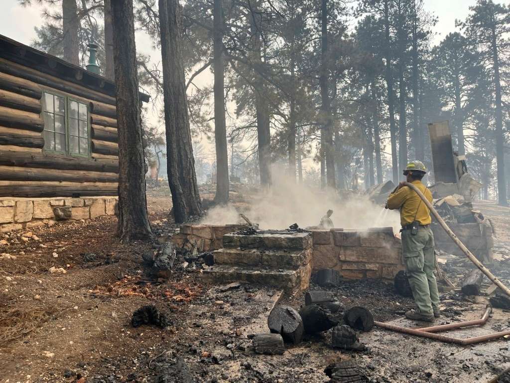This photo provided by National Park Service shows the charred remains of a building at the North Rim of Grand Canyon National Park, in northern Arizona, on Sunday.