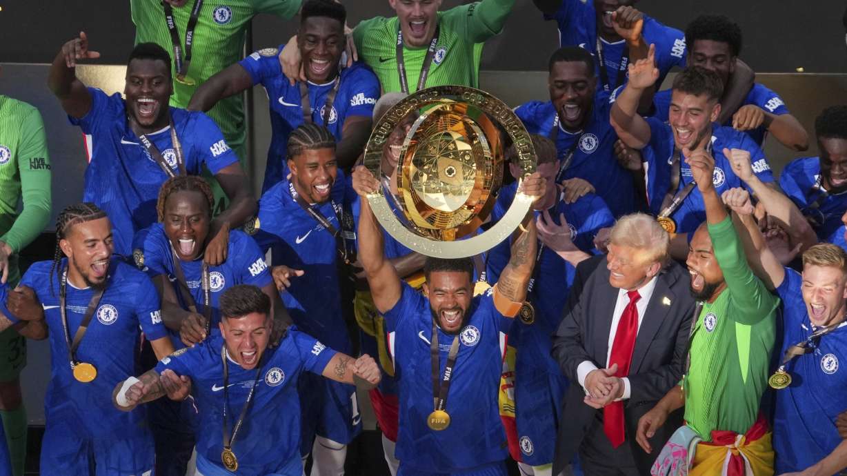 Chelsea pleayers celebrate with the championship trophy after the Club World Cup final soccer match between Chelsea and PSG in East Rutherford, N.J., Sunday, July 13, 2025.