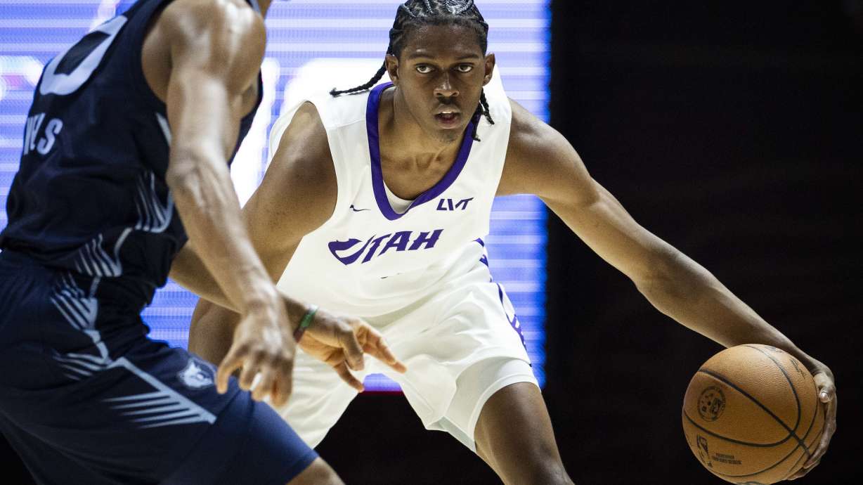 Utah Jazz forward Cody Williams (5) dribbles the ball down the court during an NBA Salt Lake City Summer League game between the Utah Jazz and the Memphis Grizzlies at the Jon M. Huntsman Center on the campus of the University of Utah in Salt Lake City on Monday, July 7, 2025.