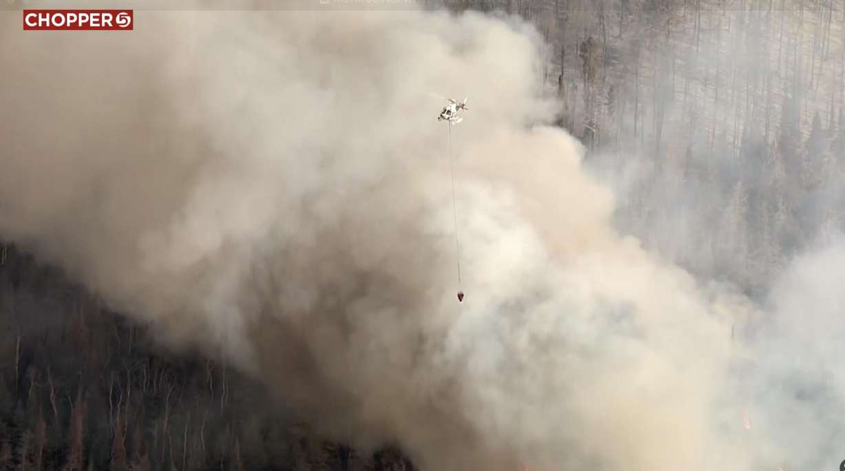 A new wildfire burns in the mountains near Monroe, Sevier County, on Sunday. The fire started in the afternoon and quickly grew to 700 acres.