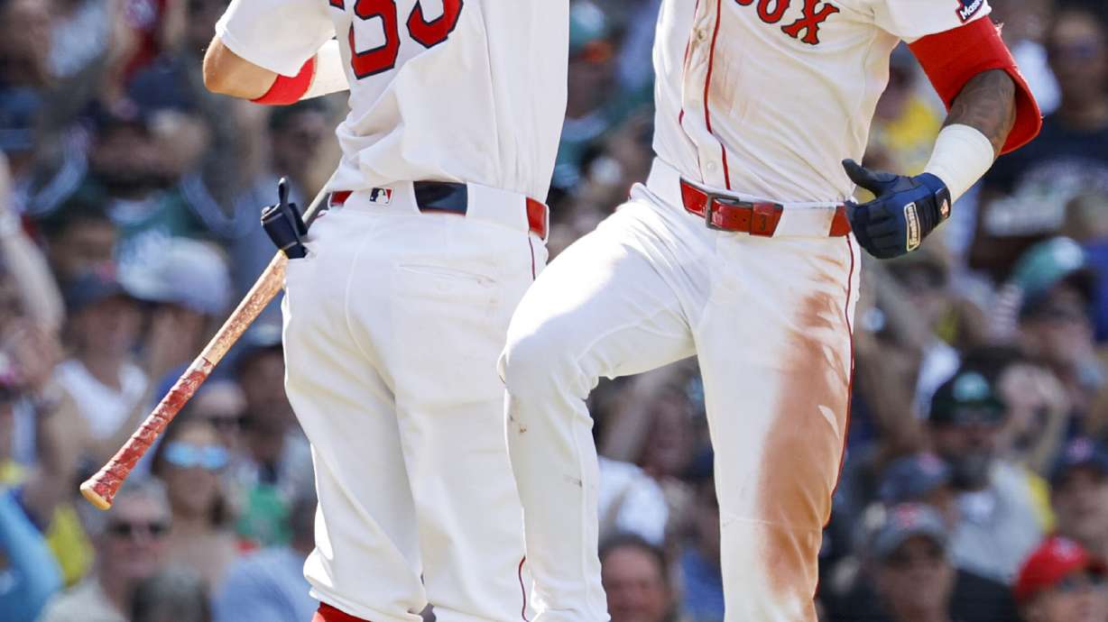 Boston Red Sox's Ceddanne Rafaela celebrates with Marcelo Mayer (39) after hitting a two run homer in the sixth inning of a baseball game, Sunday, July 13, 2025, in Boston.