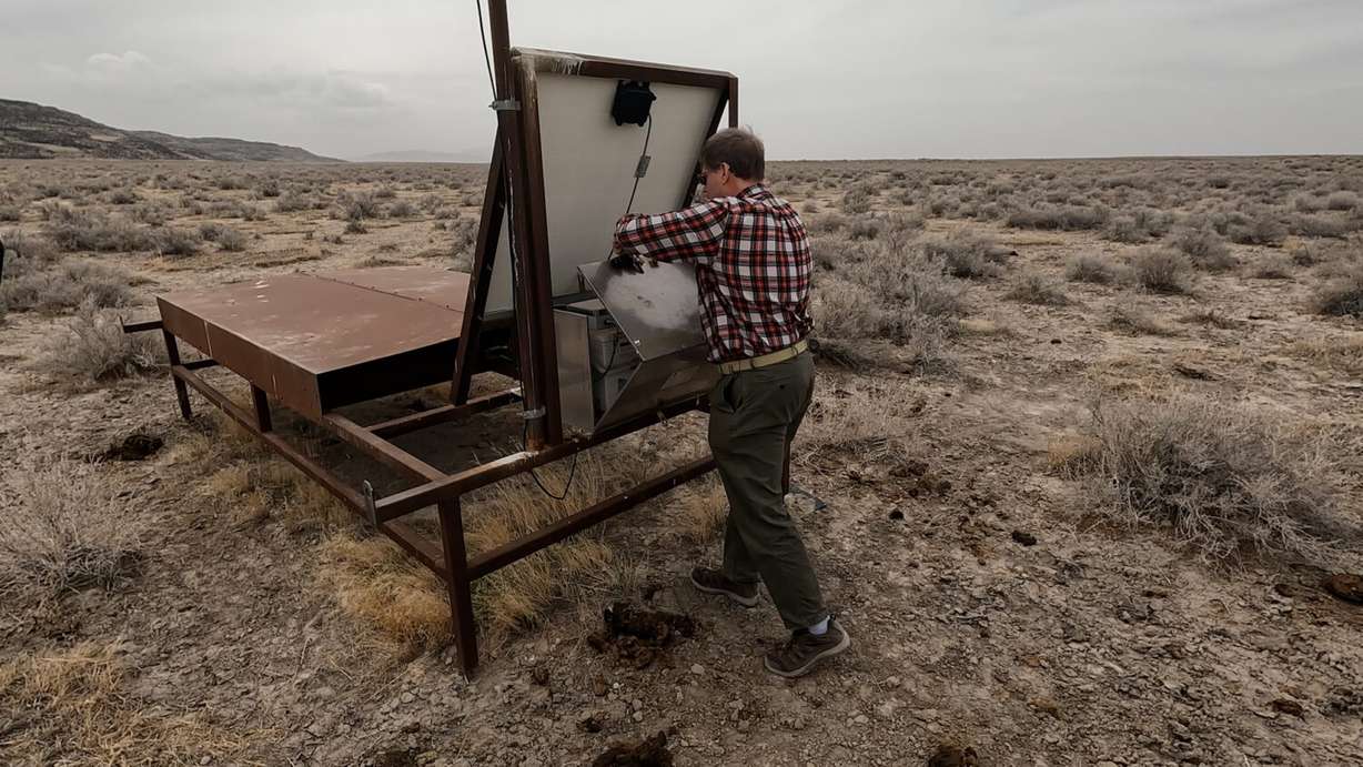 Dr. John Matthews checks on a scintillator near Delta.