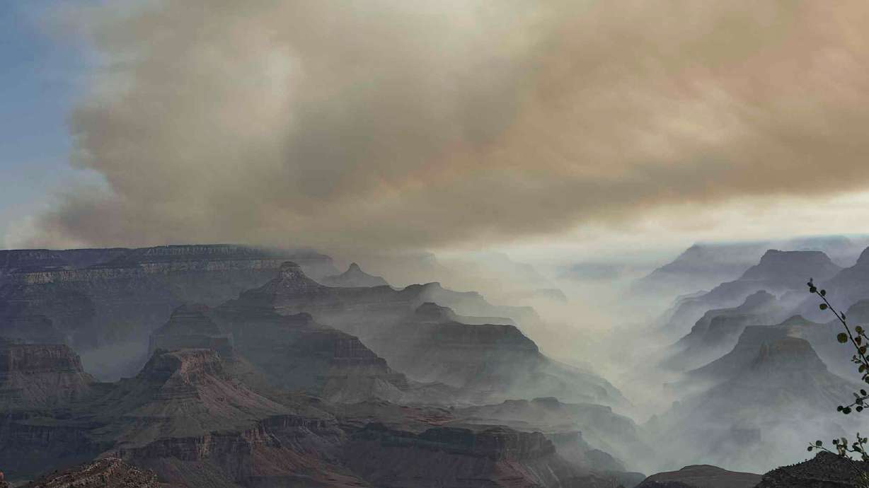 This photo provided by Caren Carney shows the family's view of fires over the Grand Canyon after they had to evacuate Grand Canyon Lodge, a historic lodge on the North Rim, in northern Arizona, Thursday.