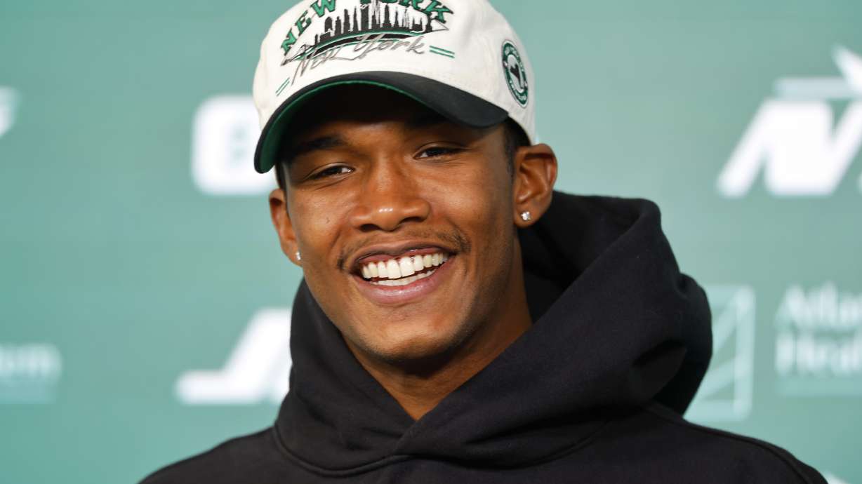 FILE - New York Jets wide receiver Garrett Wilson answers questions during a news conference following NFL football practice, May 21, 2025, in Florham Park, N.J.