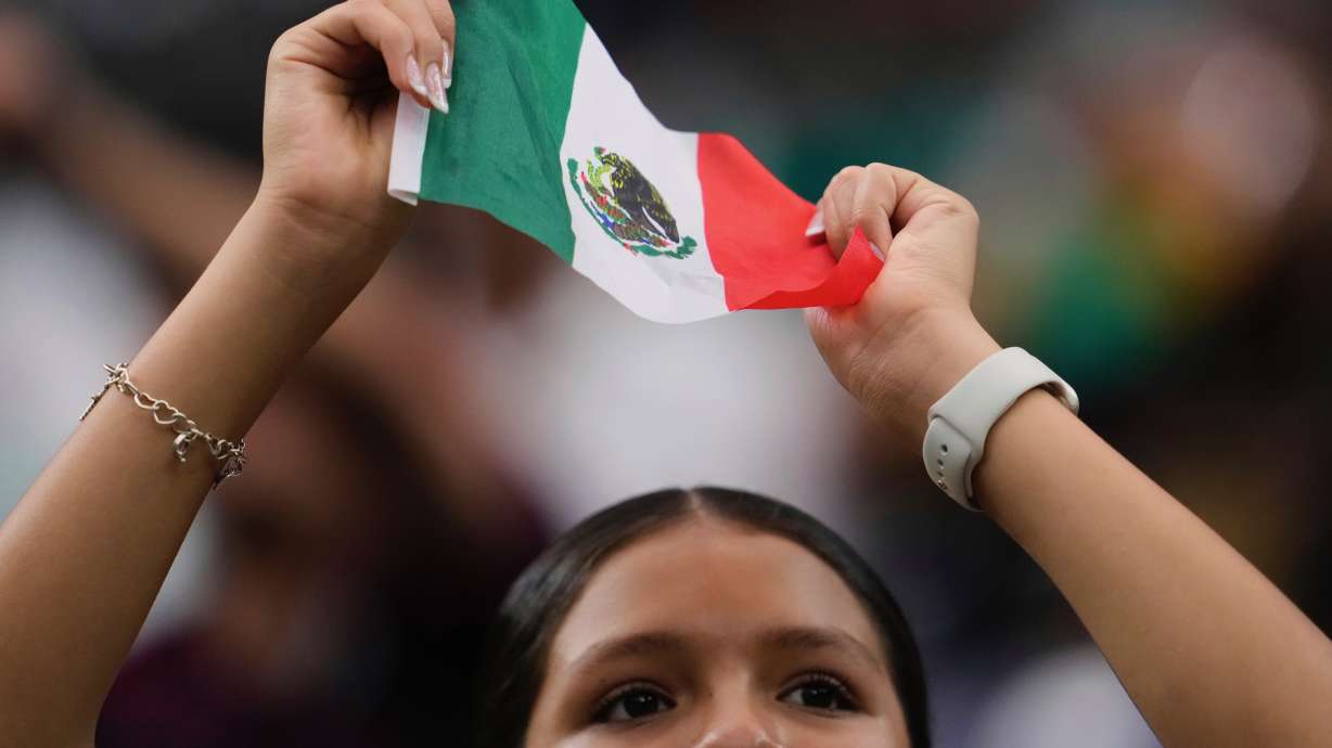 Mexicans have a generally negative view of the United States, a new Pew survey shows. A Mexico fan waves a Mexican flag before a soccer match against the United States in Houston on July 6.