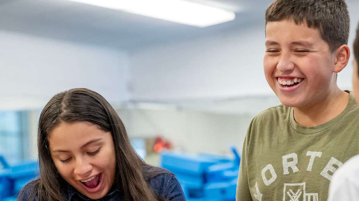 Diana, Felipe and Aman share a laugh as they make slime as they and other kids take part in summer activities assisted by counselors at Central Park Community Center in South Salt Lake City on Monday. Many of those South Salt Lake programs — and similar programs across the state and nation — could be in jeopardy because of recent federal cash freezes.