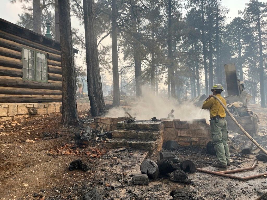 This photo provided by the National Park Service shows the charred remains of a building at the North Rim of Grand Canyon National Park in northern Arizona, on Sunday.
