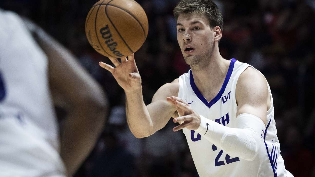 Utah Jazz forward Kyle Filipowski (22) passes the ball during an NBA Salt Lake City Summer League game between the Utah Jazz and the Memphis Grizzlies at the Jon M. Huntsman Center on the campus of the University of Utah in Salt Lake City on Monday, July 7, 2025.