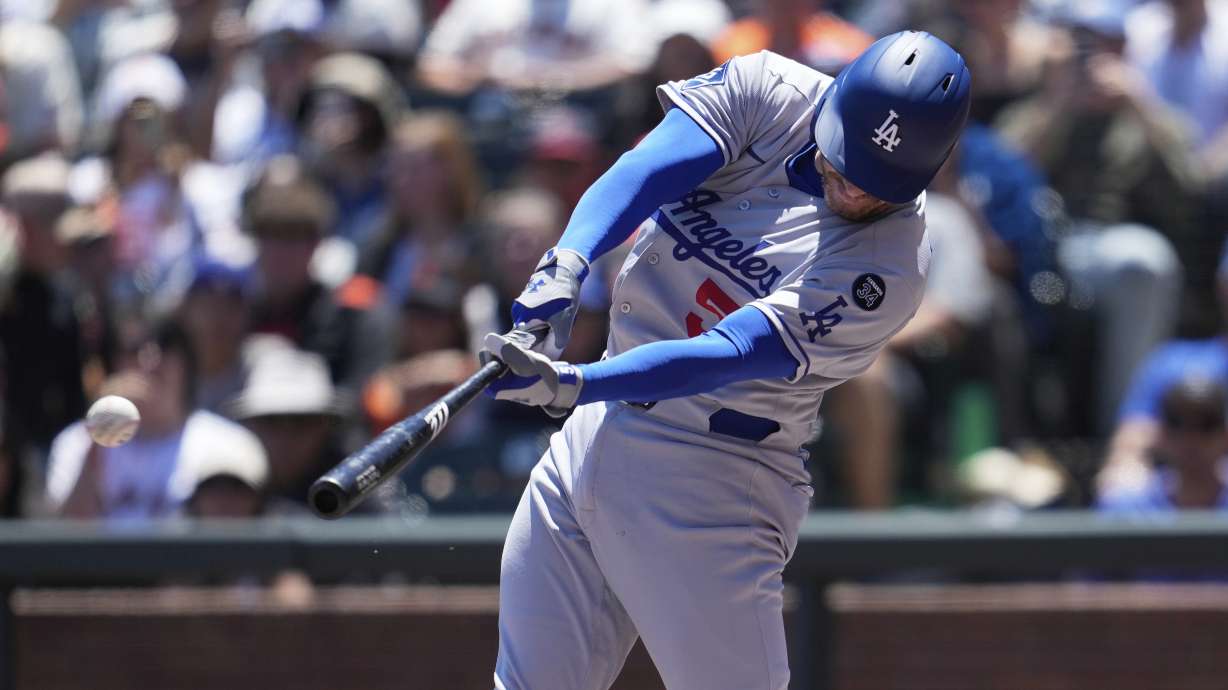 Los Angeles Dodgers' Freddie Freeman hits an RBI double against the San Francisco Giants during the fourth inning of a baseball game in San Francisco, Sunday, July 13, 2025.