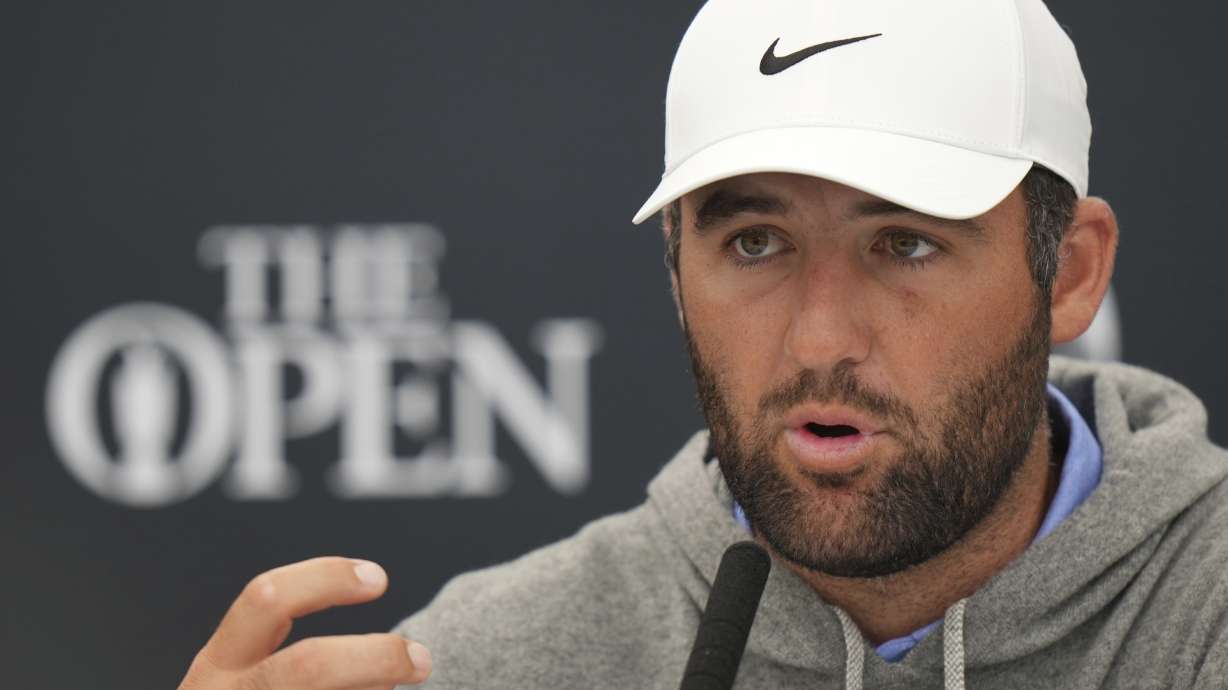 Scottie Scheffler of the United States gestures as he speaks during press conference ahead of the British Open golf championship at the Royal Portrush Golf Club, Northern Ireland, Tuesday, July 15, 2025. The Open starts Thursday.