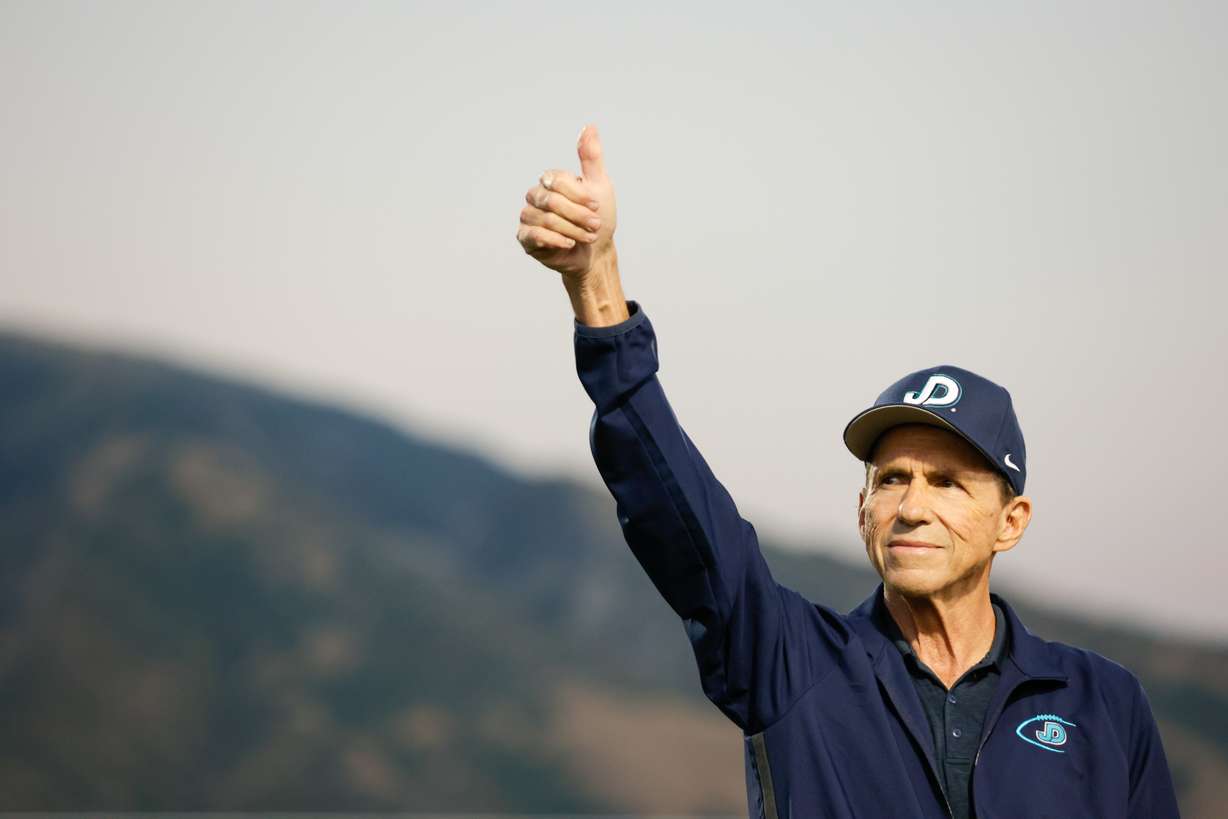 John Colosimo, former Juan Diego head football coach, gives a thumbs-up during a ceremony recognizing him by naming the field after him in Draper on Friday, Sept. 16, 2022.