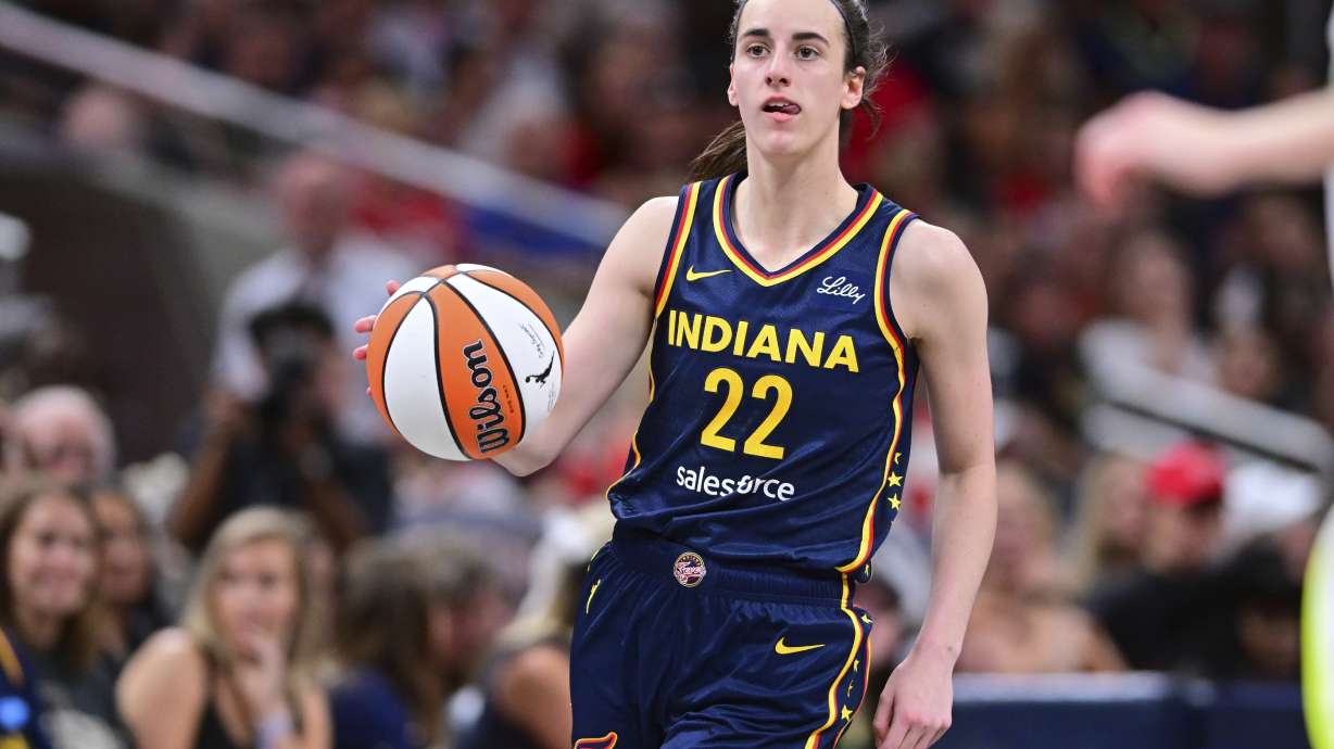 Indiana Fever's Caitlin Clark dribbles during the second half of a WNBA basketball game against the Dallas Wings, Sunday, July 13, 2025, in Indianapolis.